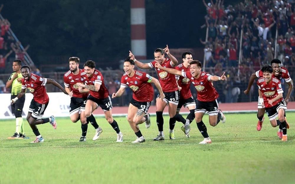 Sabah FC players celebrate after prevailing in the penalty shootout to secure the Challenge Cup.