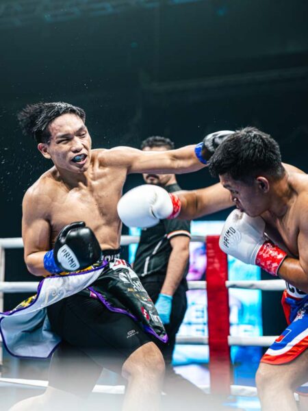 A thrilling exchange unfolds inside the ring during one of the professional bouts at Twins Championship 104, held before a packed crowd in Kota Kinabalu.